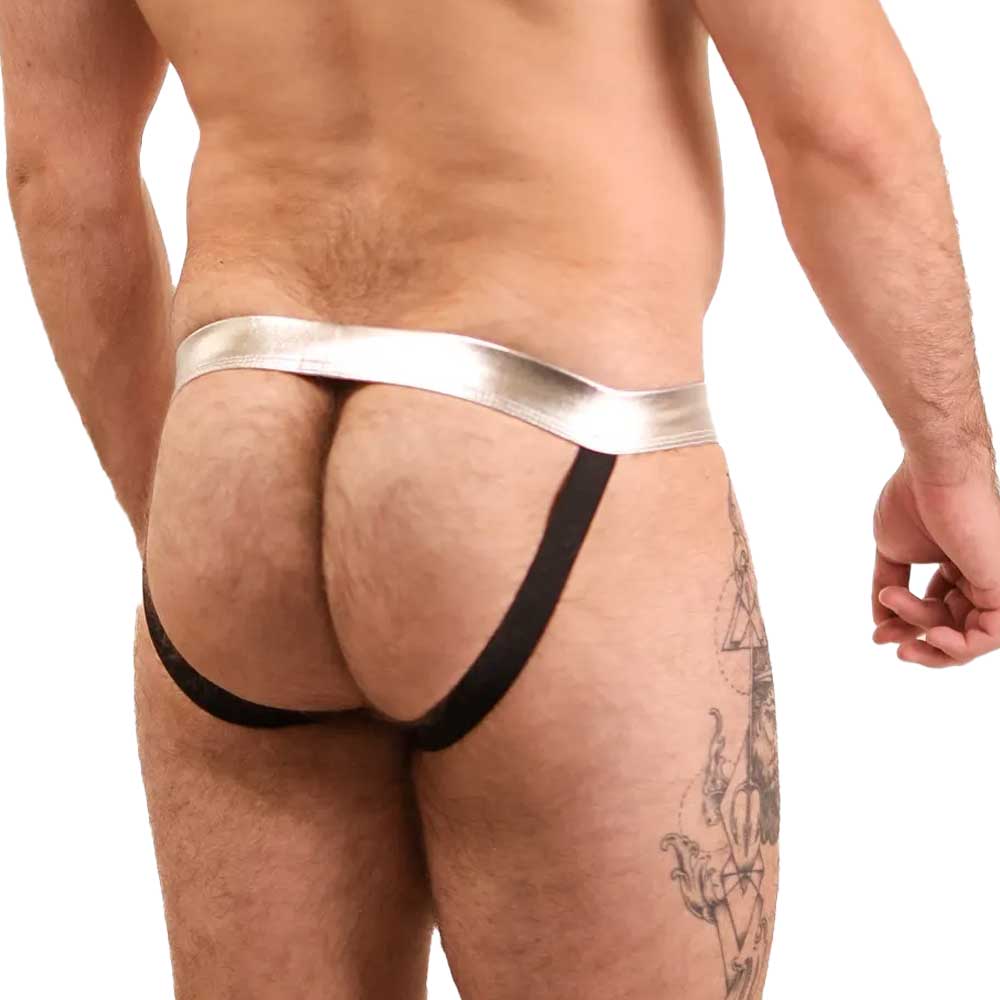 Man wearing a black and silver thong on a white background. Bold Envy Gay Mens Jock Strap Sexy Apparelz